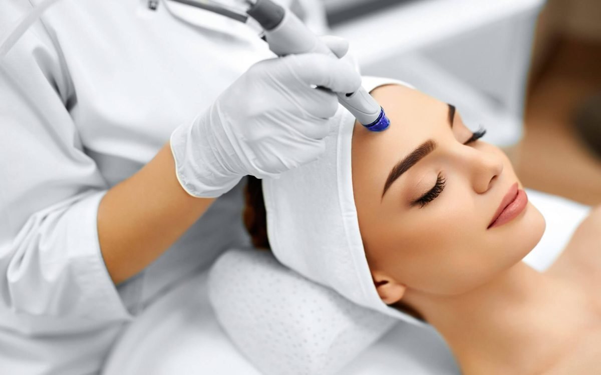 Client receiving a facial treatment at a modern medical spa